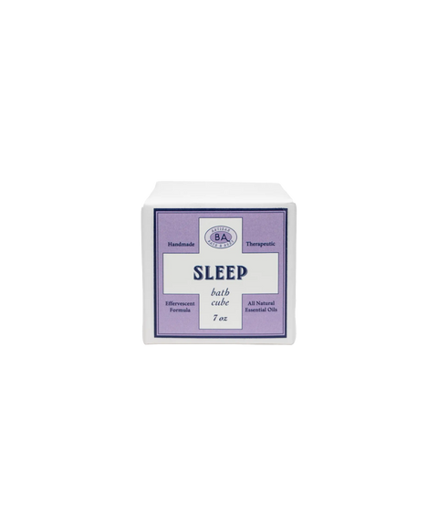Baudelaire Sleep bath cube in a white package with a lavender label, indicating natural ingredients.