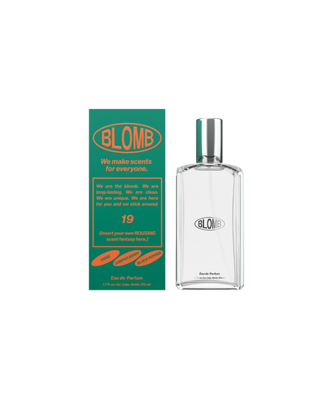 A clear, glass, rectangular perfume bottle of Blomb No. 19 next to its green box.