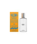 A clear, glass, rectangular perfume bottle of Blomb No. 23 next to its marigold box.