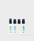 Four clear BLOMB perfume sample spray vials lined in a row with 15, 31, 03, and 27 printed on them.