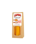 Caponi Tagliatelle gluten free pasta in a brown kraft paper bag with a clear window showing pasta inside.