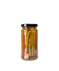 A glass jar of Dilly Dilly Provisions pickled dilly beans with a black lid.