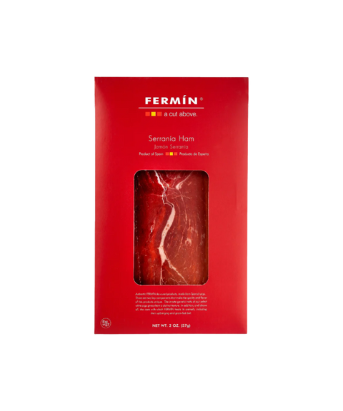 Fermin Serrania Ham, featuring a bright red package with a clear window displaying the sliced cured ham inside.