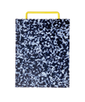 A rectangular plastic cutting board with a black and white marbled pattern and yellow metal handle, shown on a plain white background.