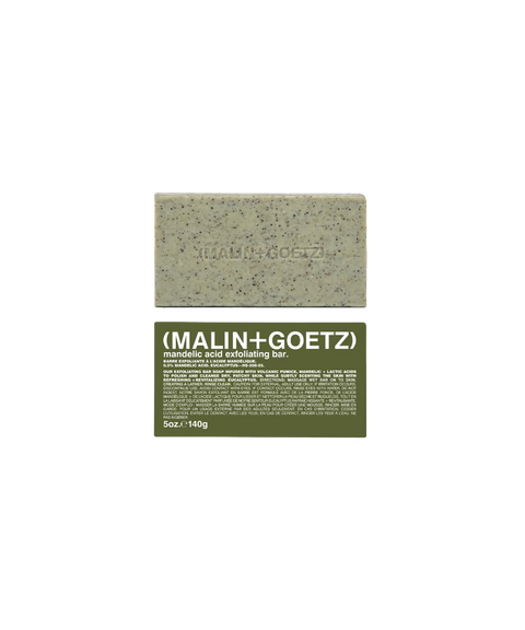 Malin+Goetz mandelic acid exfoliating bar soap in eucalyptus scent above its green product box.