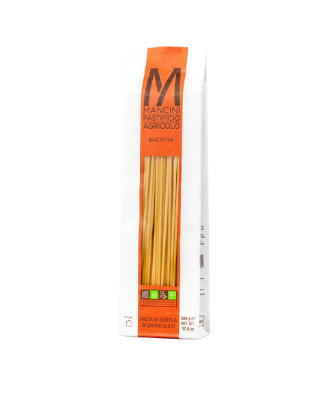 A bag of Mancini Pastifico Agricolo bucatini pasta with a clear window revealing pasta inside.