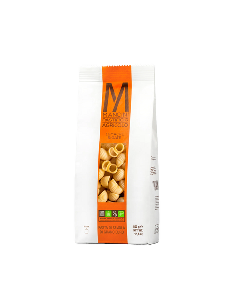 A bag of Mancini Pastifico Agricolo lumache rigate pasta with a clear window revealing pasta inside.