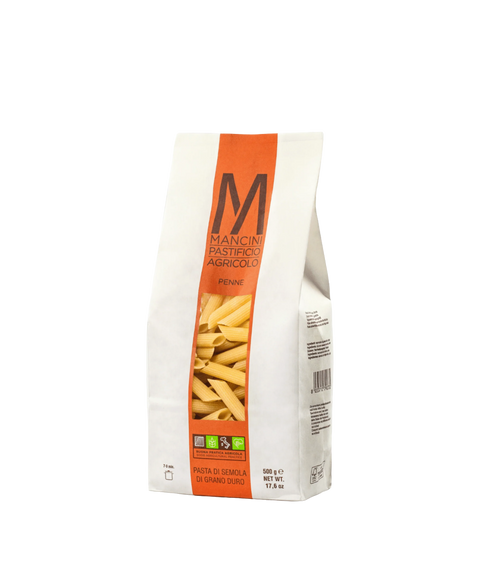 A bag of Mancini Pastifico Agricolo penne pasta with a clear window revealing pasta inside.