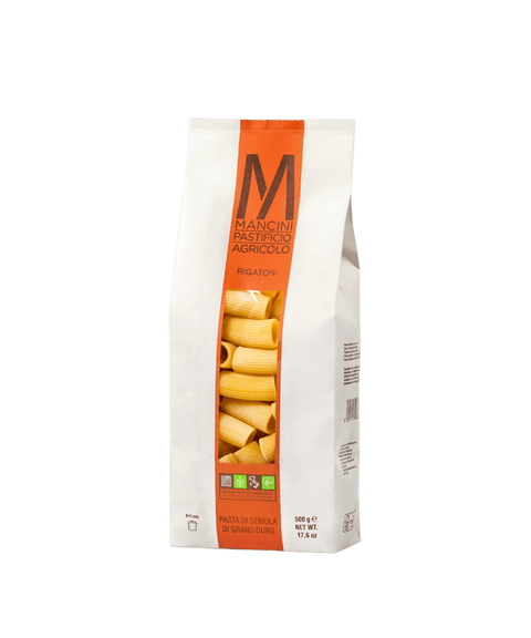 A bag of Mancini Pastifico Agricolo rigatoni pasta with a clear window revealing pasta inside.