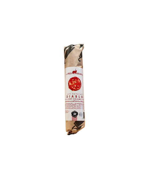 Red Bear Provisions Diablo pork salami wrapped in kraft paper with a white and red label.