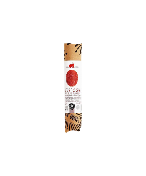 Red Bear Provisions Holy Cow! beef dry salami wrapped in kraft paper with a white and red label.
