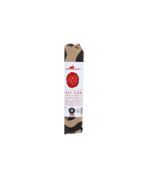 Red Bear Provisions Tipsy Cow beef salami wrapped in kraft paper with a white and red label.