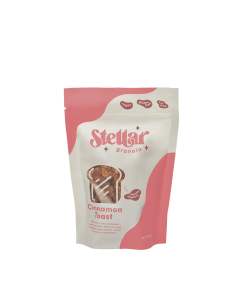 A bag of Stellar Granola in 'Cinnamon Toast' flavor with a pink and white graphic design.