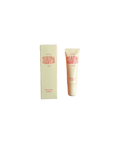 Suavina original lip balm in a cream-colored tube next to its matching cream packaging box with coral branding.