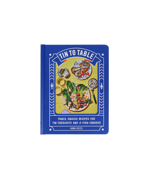 'Tin to Table' cookbook by Anna Hezel, featuring a vibrant blue cover with a photo of a salad, toast and tinned fish.